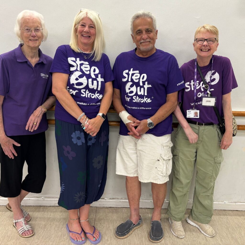 4 team members in purple stroke association t shirts